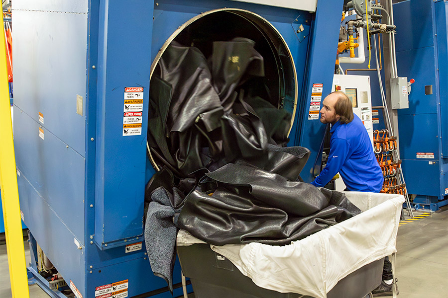 Pulling large commercial floor mats from industrial cleaner